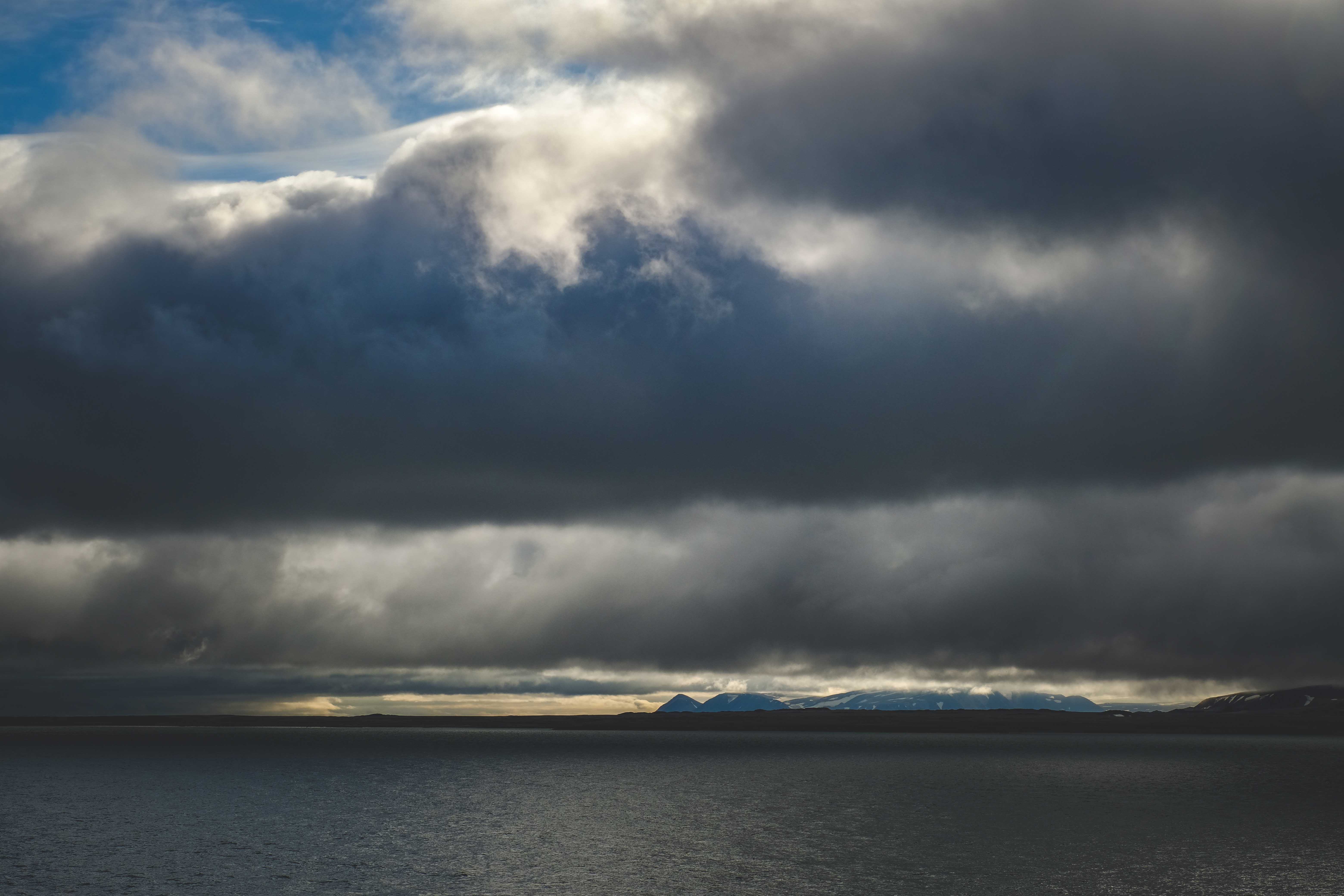Rain Clouds over Sea Coast · Free Stock Photo