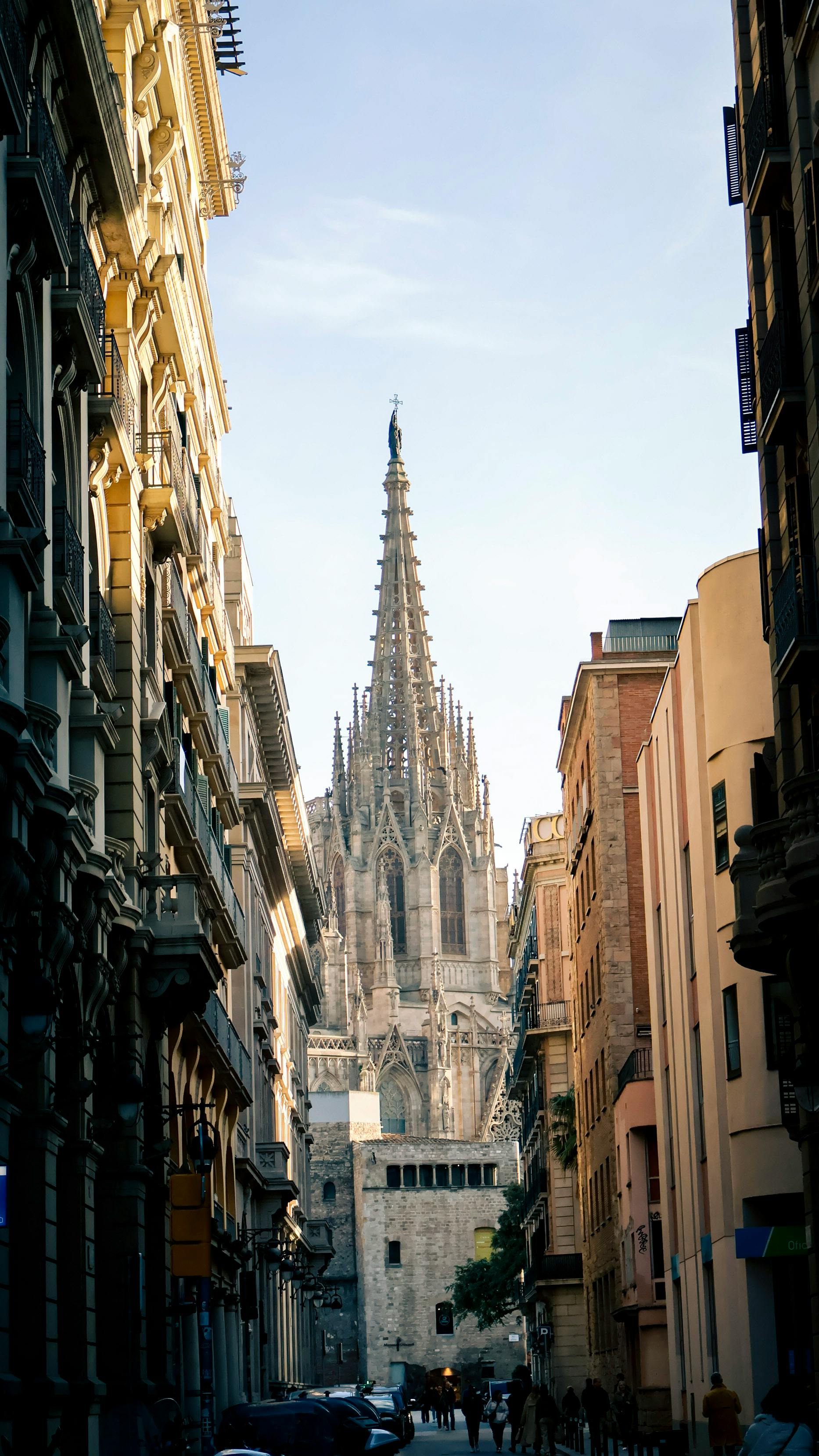 tower of barcelona cathedral behind street