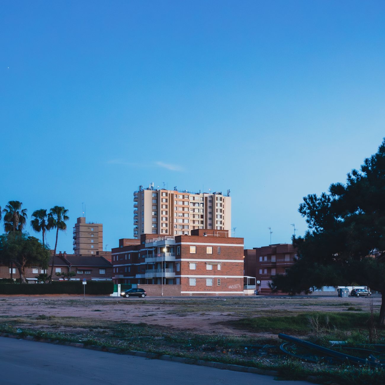 Skyline of residential buildings under a clear blue sky in San Javier, Spain.