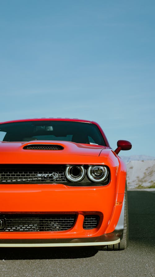 Free The front end of an orange dodge challenger Stock Photo