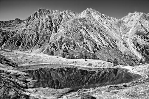 Black and white photograph of a mountain lake