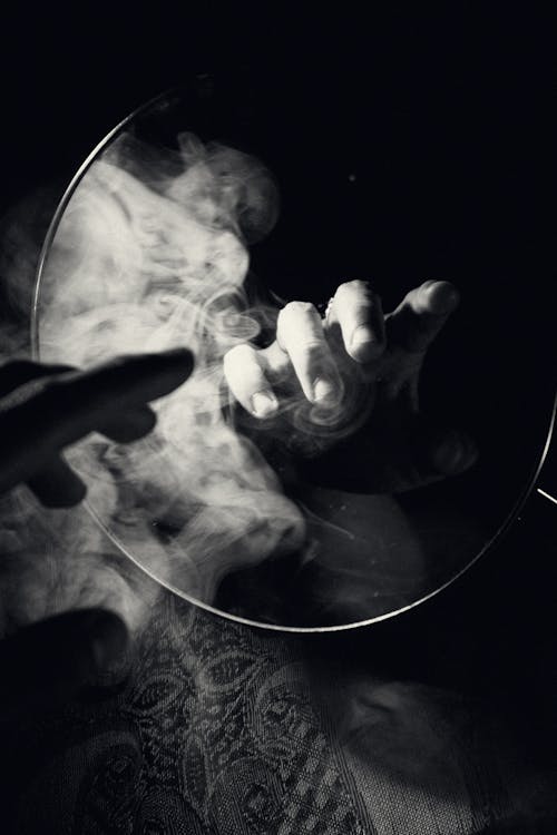 Fingers and Smoke in Mirror