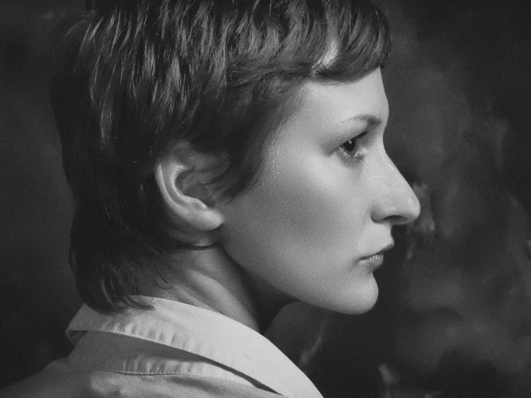 Grayscale Photography Of Pixie-cut Woman Facing Side Ward