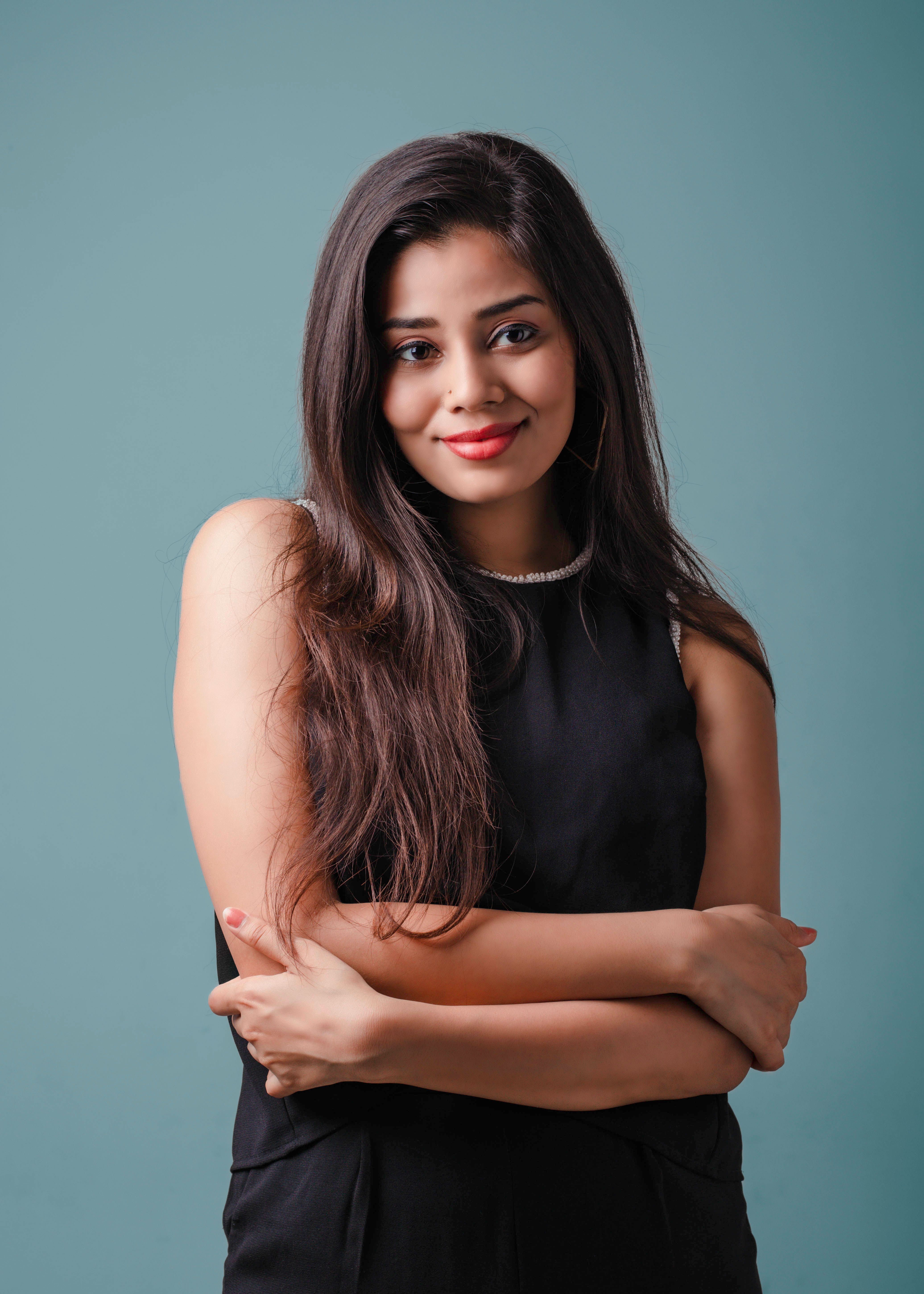 Smiling Brunette in Black Dress · Free Stock Photo