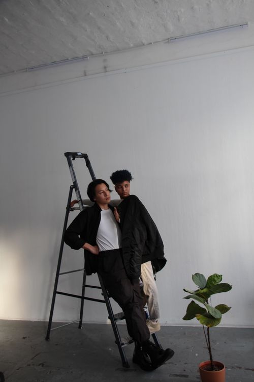 Ladder Photo Modern Studio Shot of Models Standing on a Ladder · Free Stock Photo