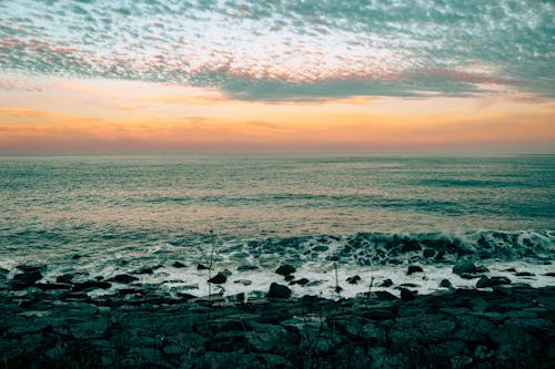 View of a Rocky Shore at Sunset