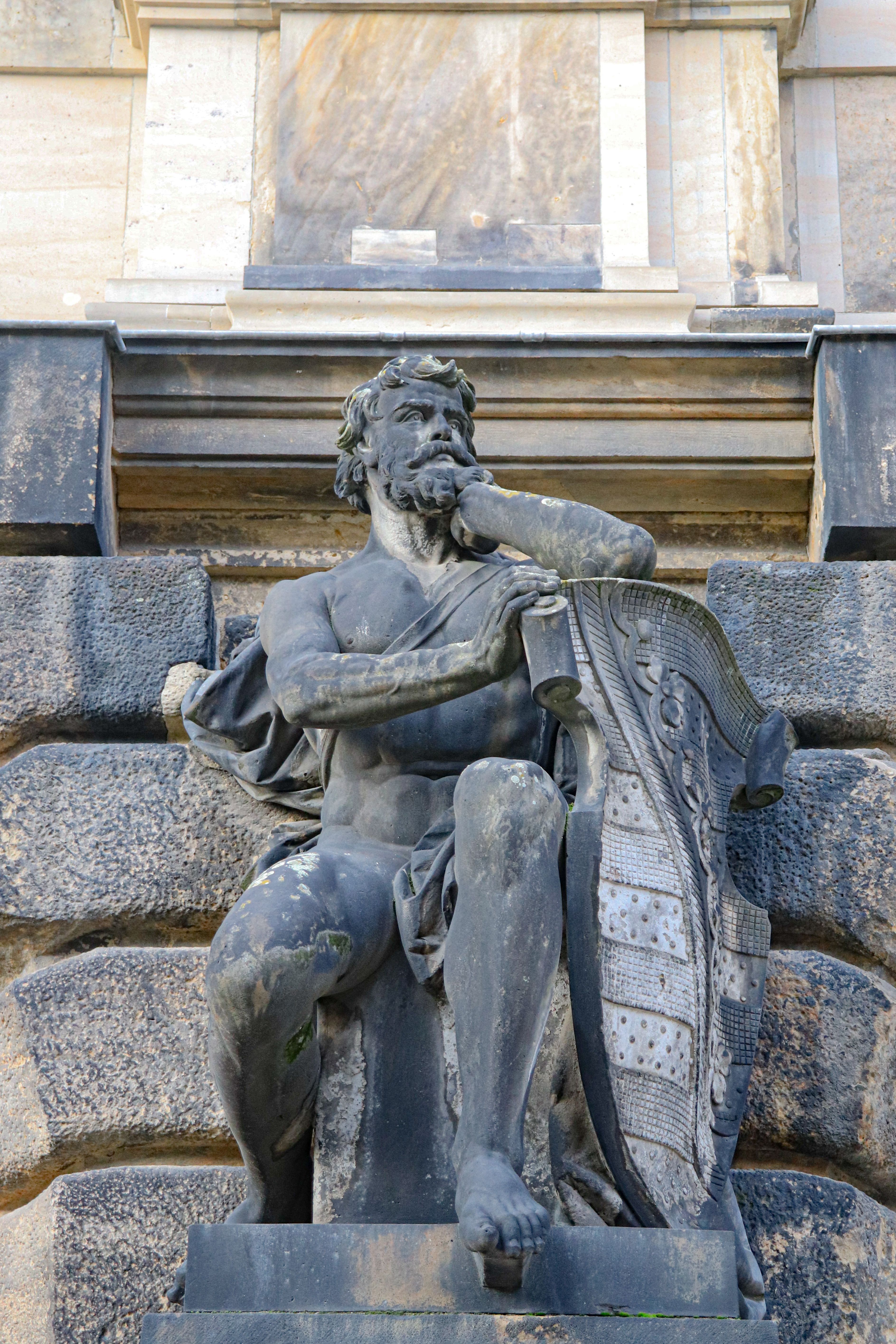 Close-up of a detailed sculpture from the facade of a Dresden landmark.