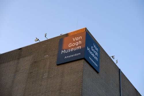 The sign for the johnson goe museum is on top of a building