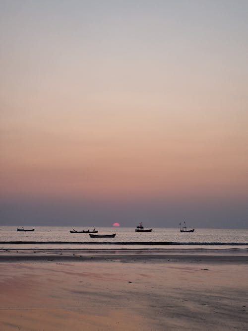 View of Boats on the Sea at Sunset