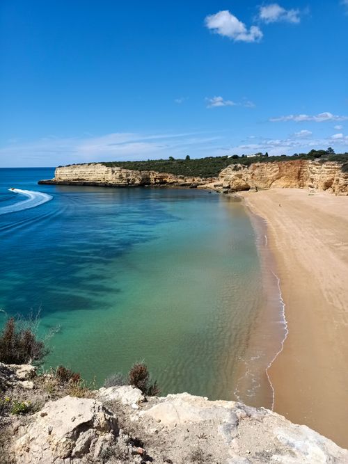Free Stunning coastal view of Algarve beaches and cliffs under a clear blue sky in Portugal. Stock Photo