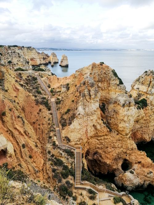 Free Breathtaking view of Ponta da Piedade with steep stairs and ocean backdrop in Lisboa, Portugal. Stock Photo