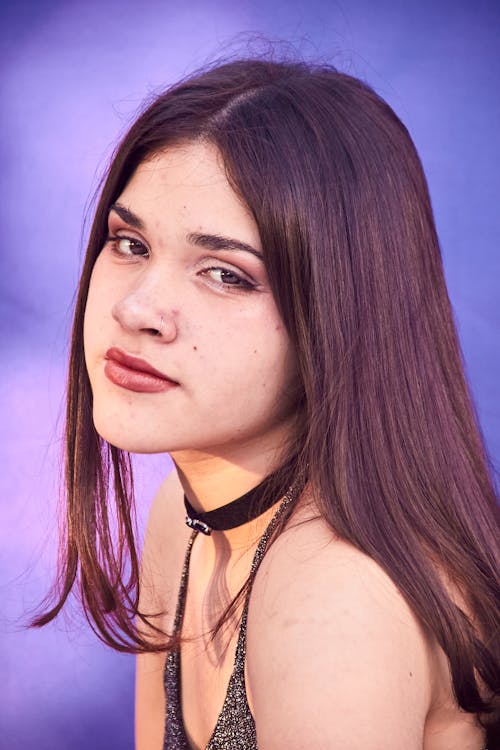 A young woman with long hair posing for a portrait