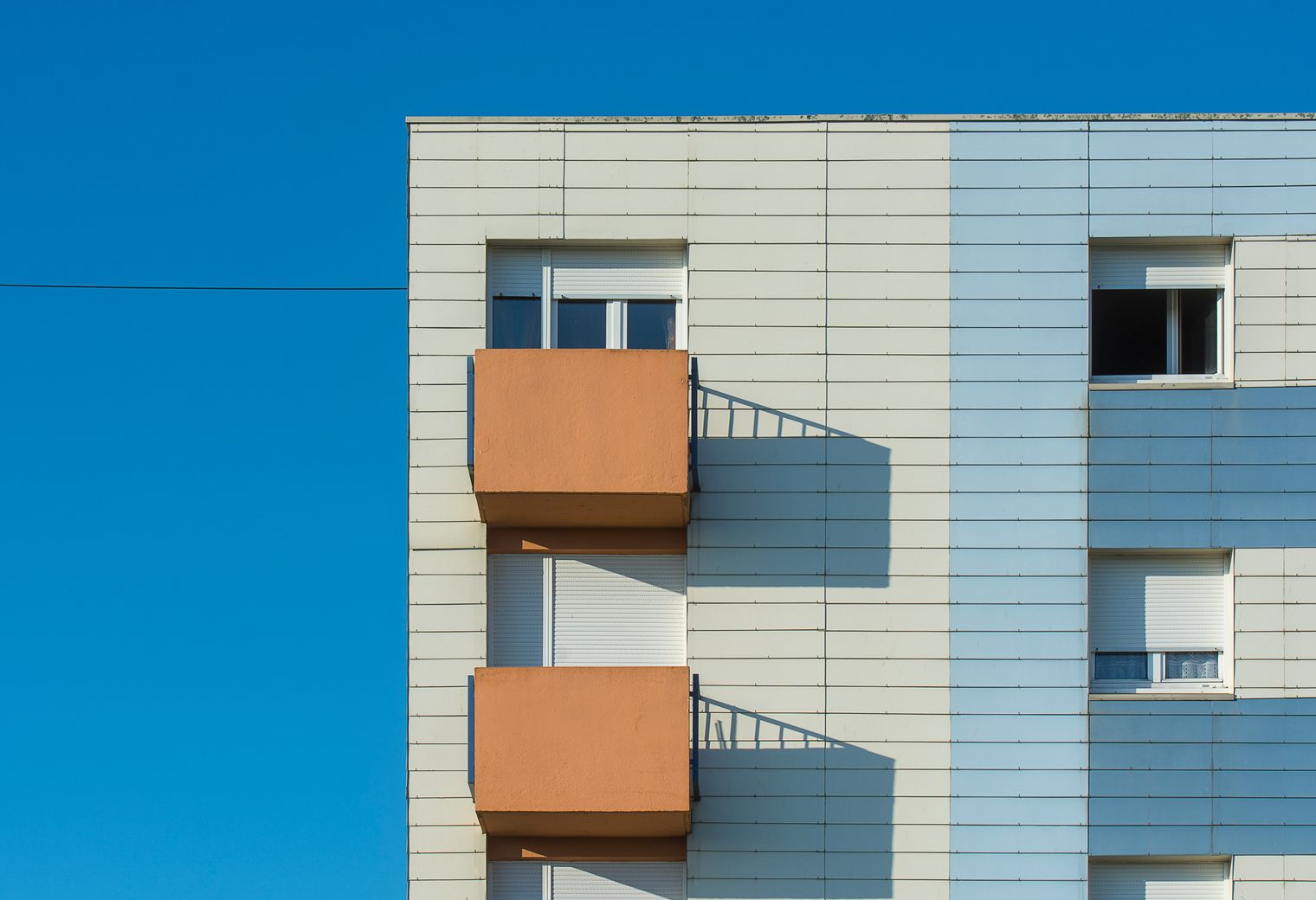 Exterior Painting in Millwall — a decorator at work mid-project