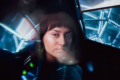 A woman in a futuristic setting with a camera