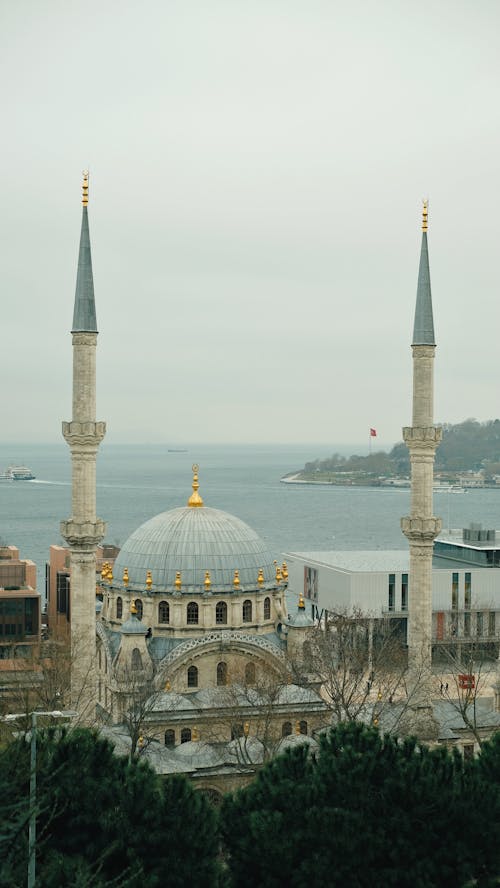 A view of a mosque with a view of the water