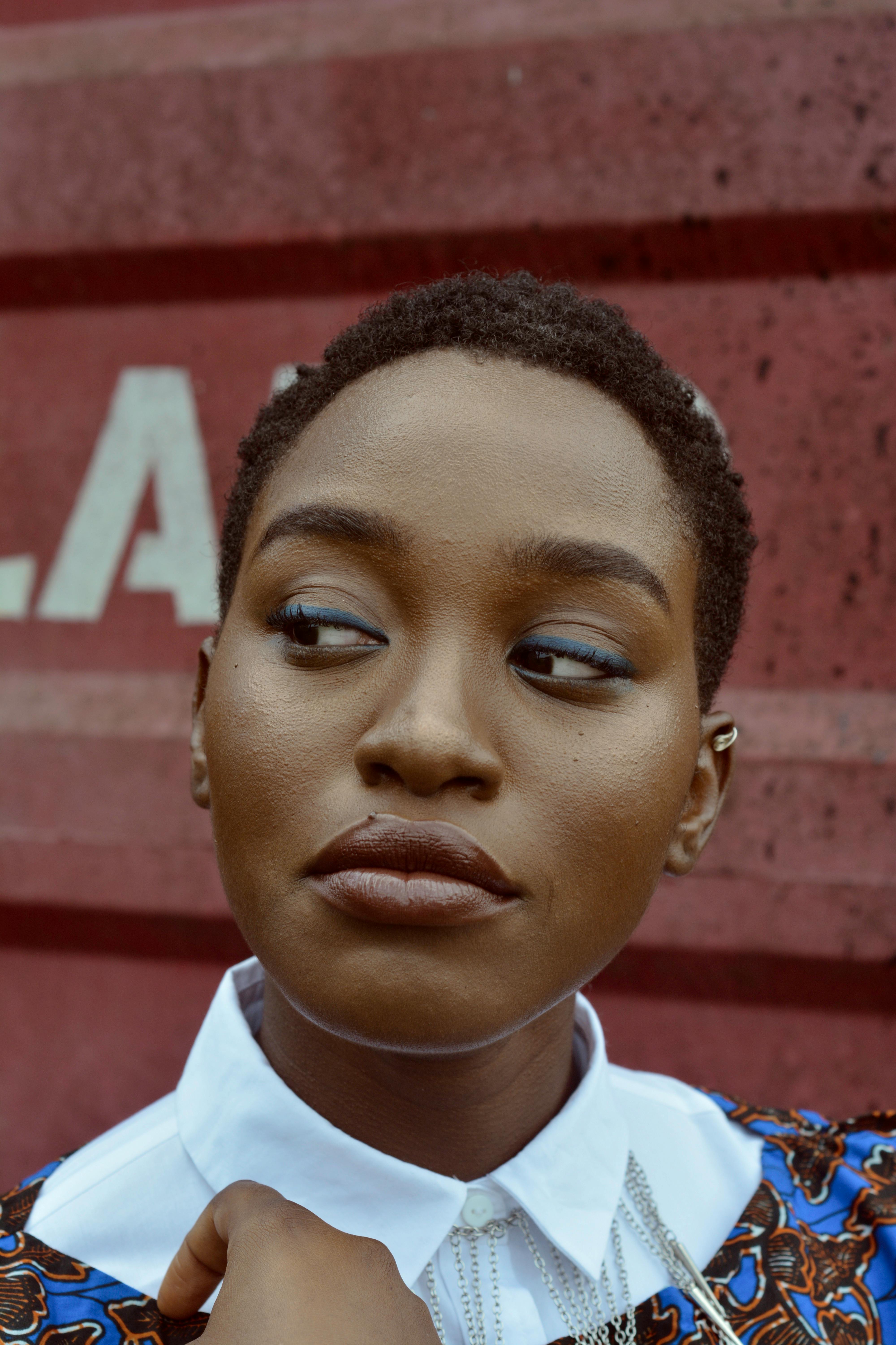 Close-up portrait of a stylish woman with short hair in Lagos, Nigeria.