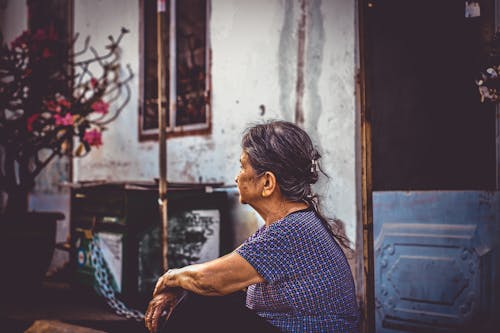 Woman Sitting Near Door