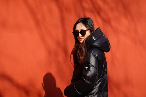 Woman in Sunglasses and Black Jacket