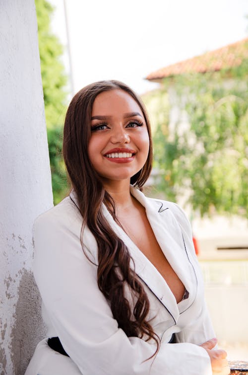 Smiling Woman in White Suit