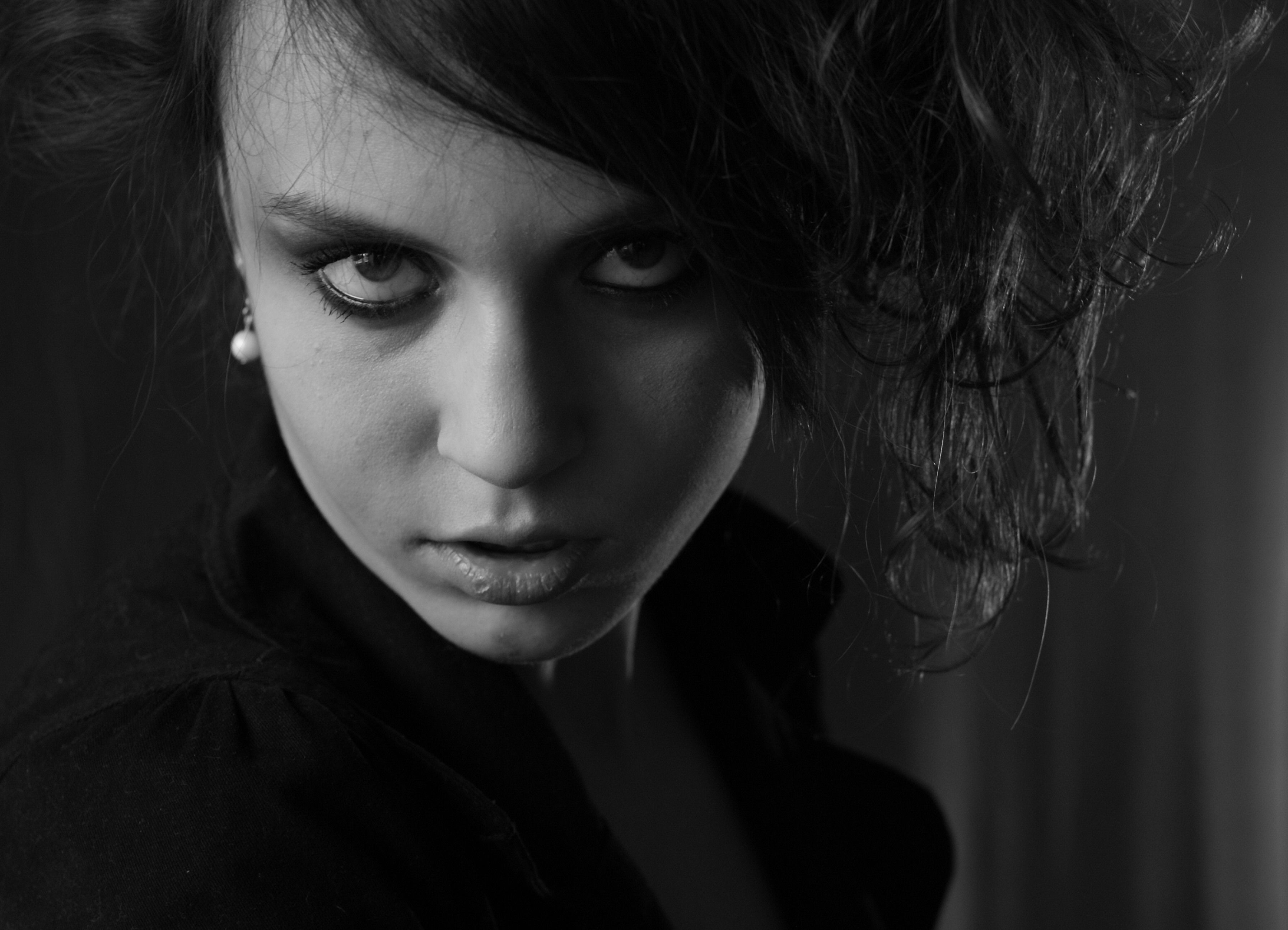 Black and white portrait of a woman with dark hair · Free Stock Photo