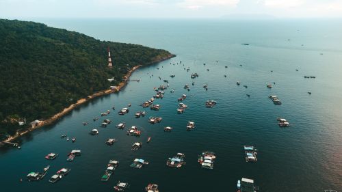 Free Stunning aerial shot of houseboats along the seashore of Kiên Giang, Việt Nam. Stock Photo
