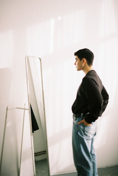 A man standing in front of a mirror