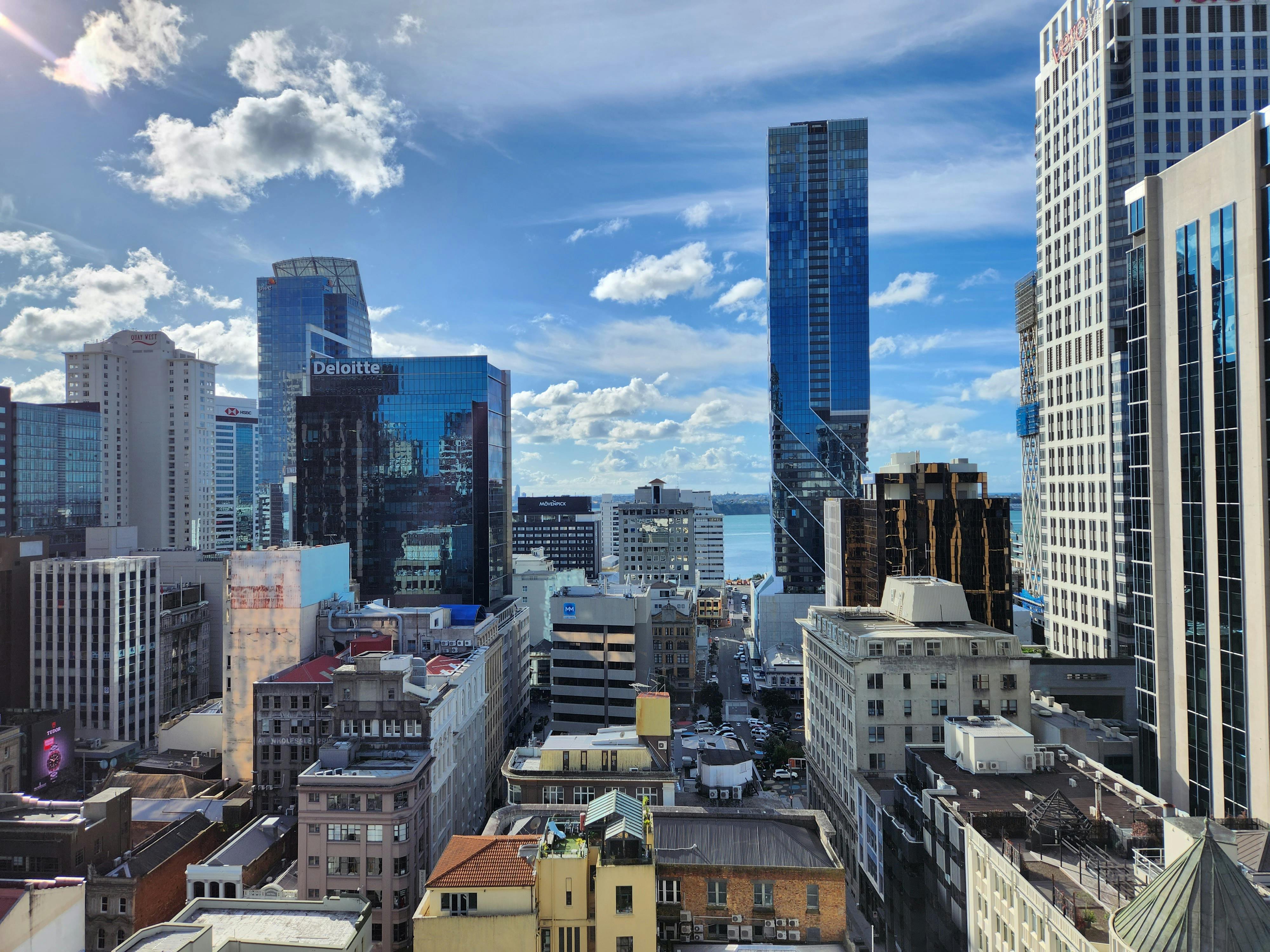 Stunning view of Auckland's urban skyline with modern skyscrapers under a clear blue sky.