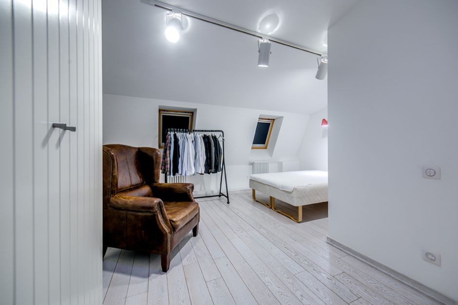5 Essential Space-Saving Ideas for a Clothes Rack in Your Small Bedroom: A Hanamori Guide Modern small bedroom with a space-saving clothes rack and minimalist decor