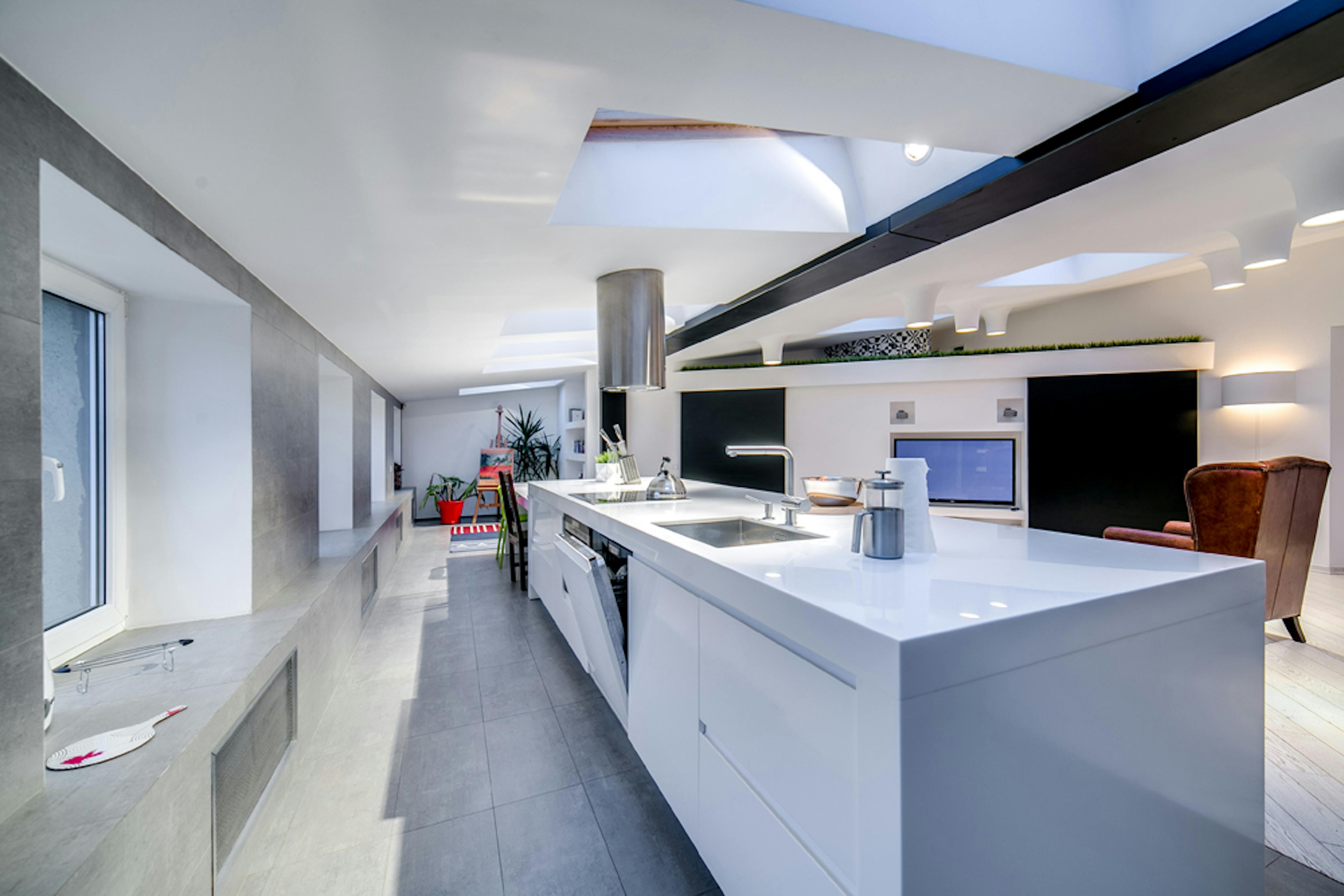Luxury attic transformation with dramatic ceiling architecture