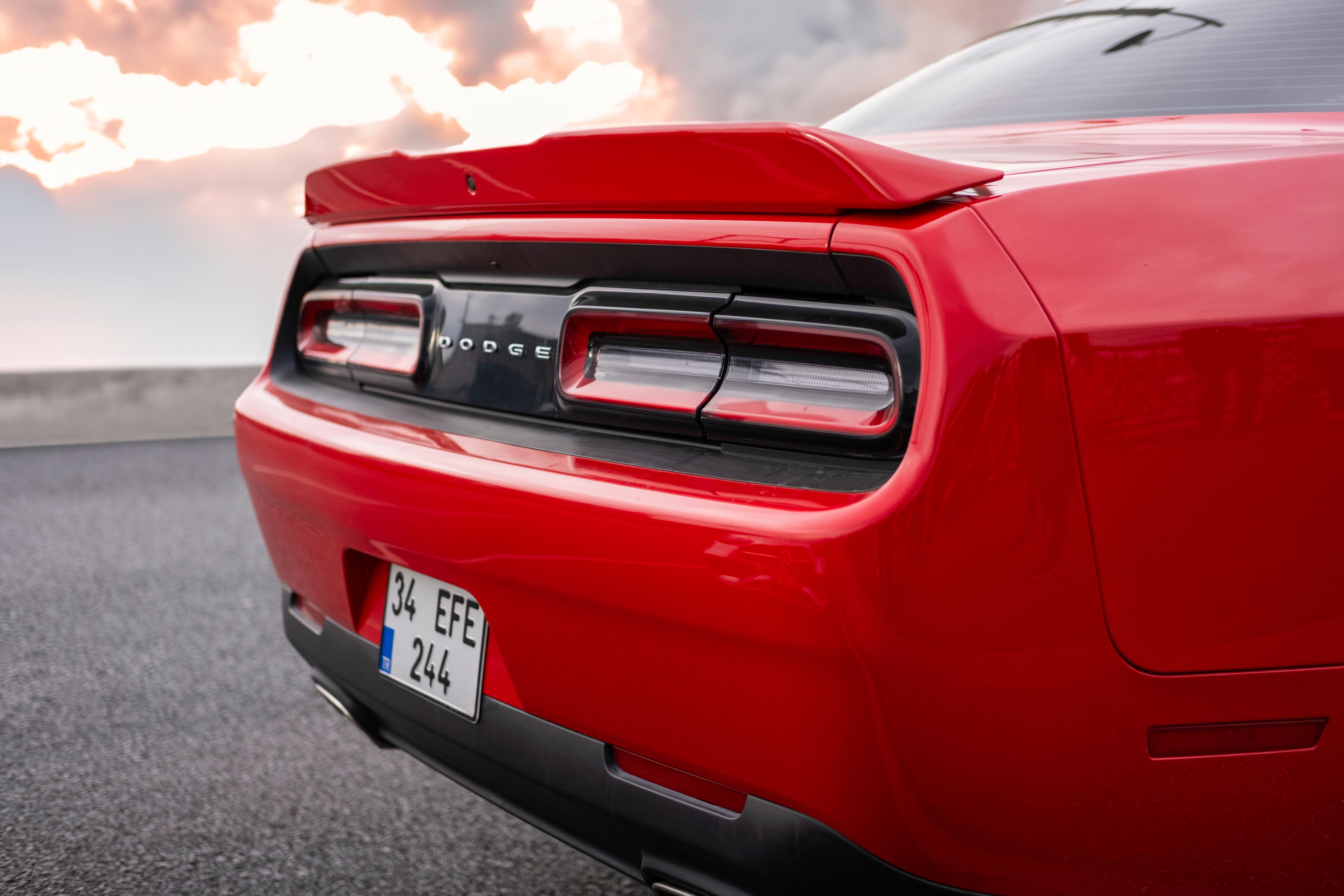 The rear end of a red dodge challenger · Free Stock Photo
