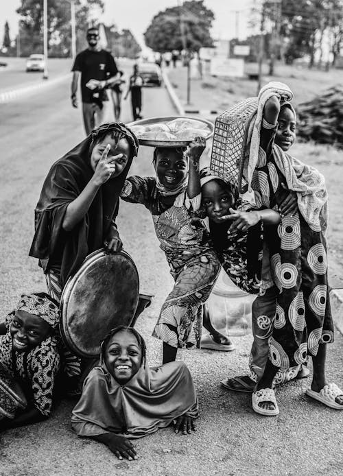 A group of people on the side of the road