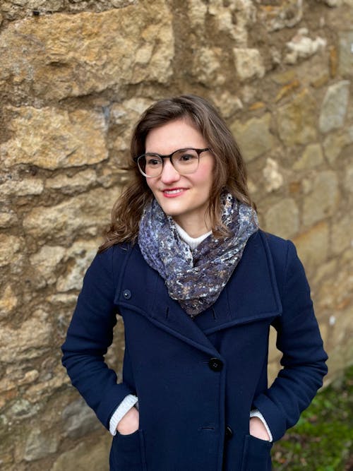 Portrait of Smiling Woman in Blue Coat