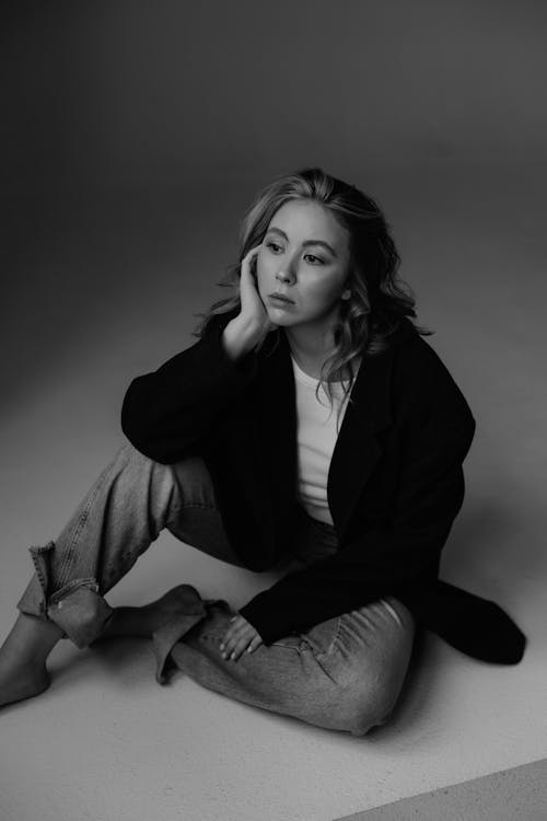 Black and White, Minimalist Studio Shot of a Young Woman in a Casual Outfit 