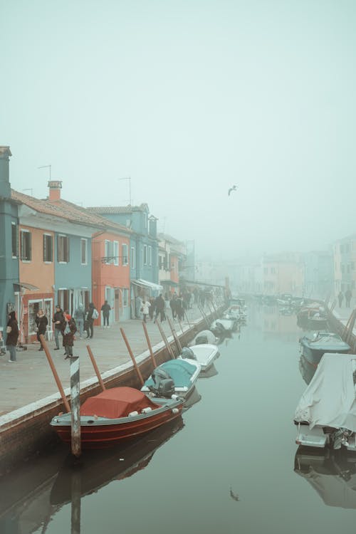 A foggy day with boats on the water