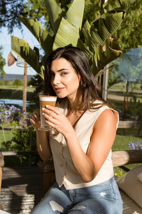 Woman with Glass of Coffee in Summer