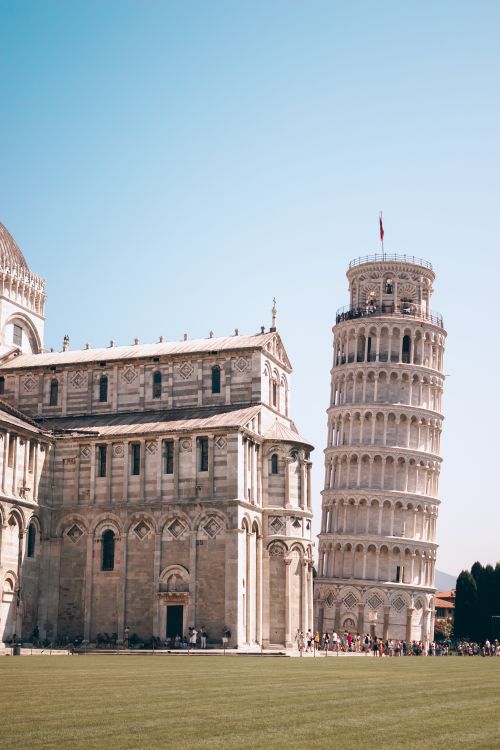 Free The iconic Leaning Tower of Pisa on a sunny day in the Piazza dei Miracoli, Italy. Stock Photo