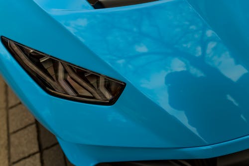 Headlight of a Blue Sports Car