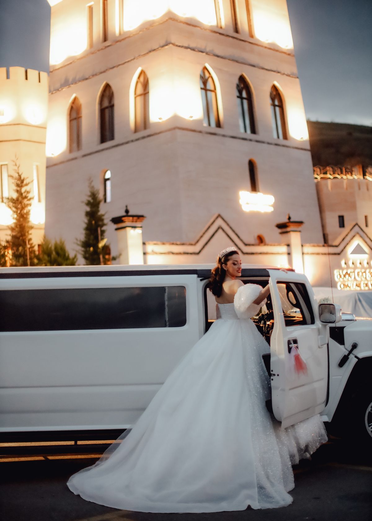 Bride stepping into a limousine
