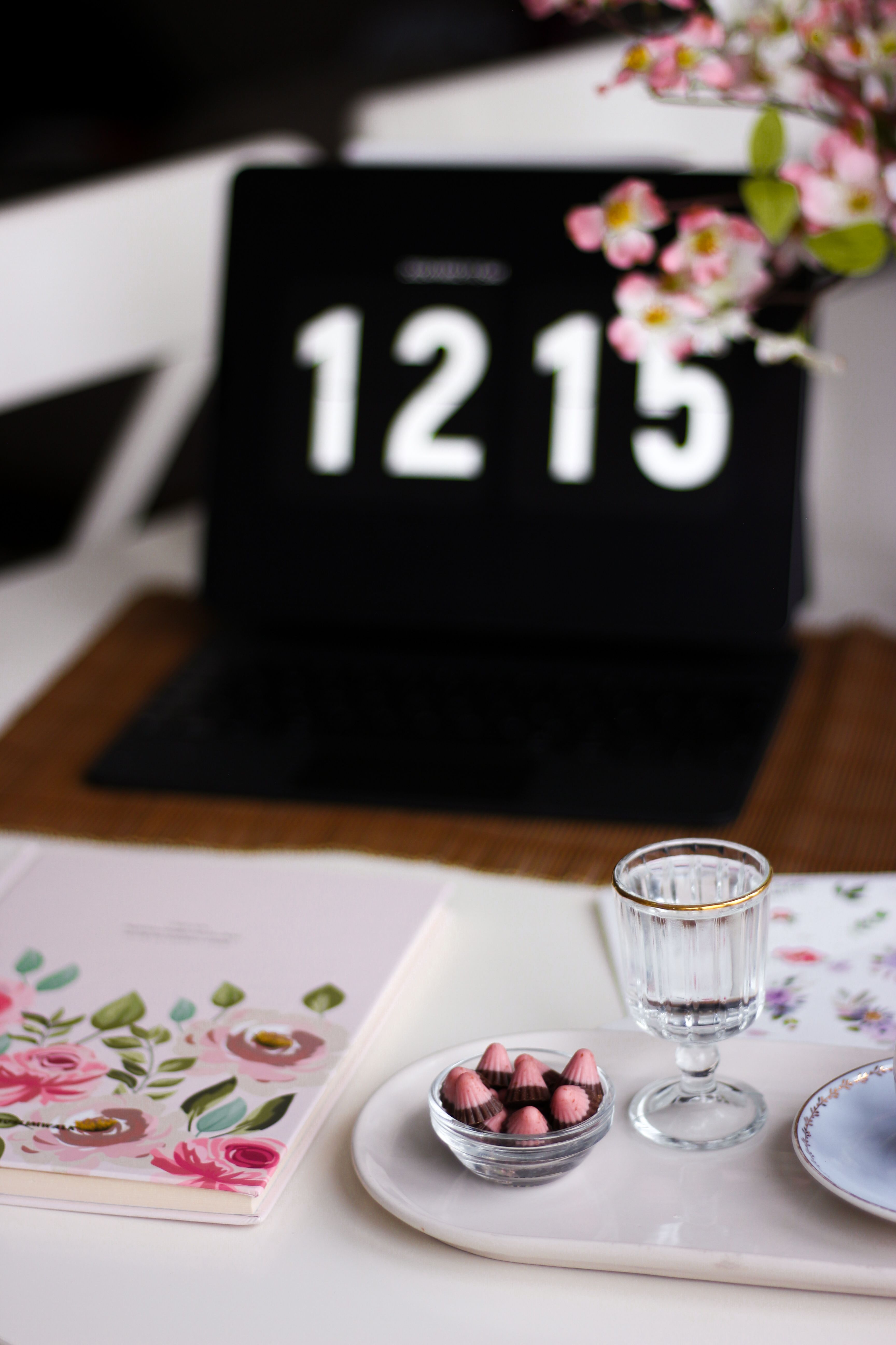 Time on Laptop behind Notebook and Tray with Snack and Glass · Free ...