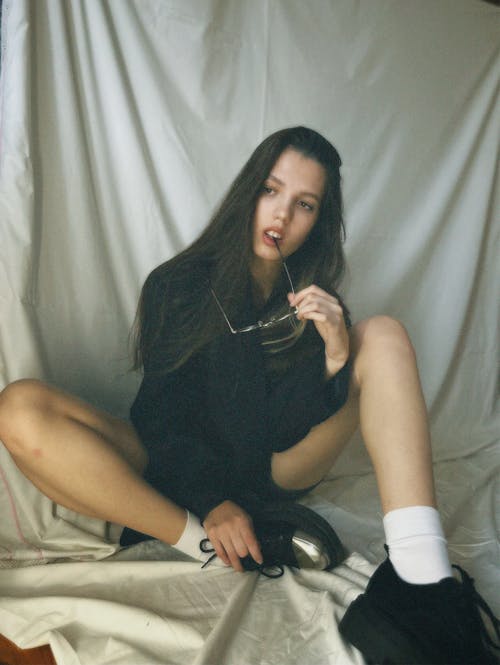 Young, Fashionable Woman Sitting on the Floor 