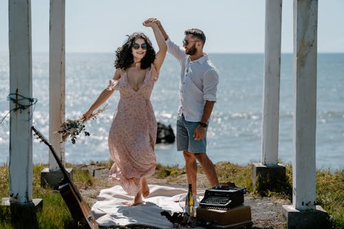 Smiling Couple on Picnic on Sea Coast