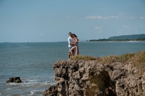 A Couple Embracing on a Shore 