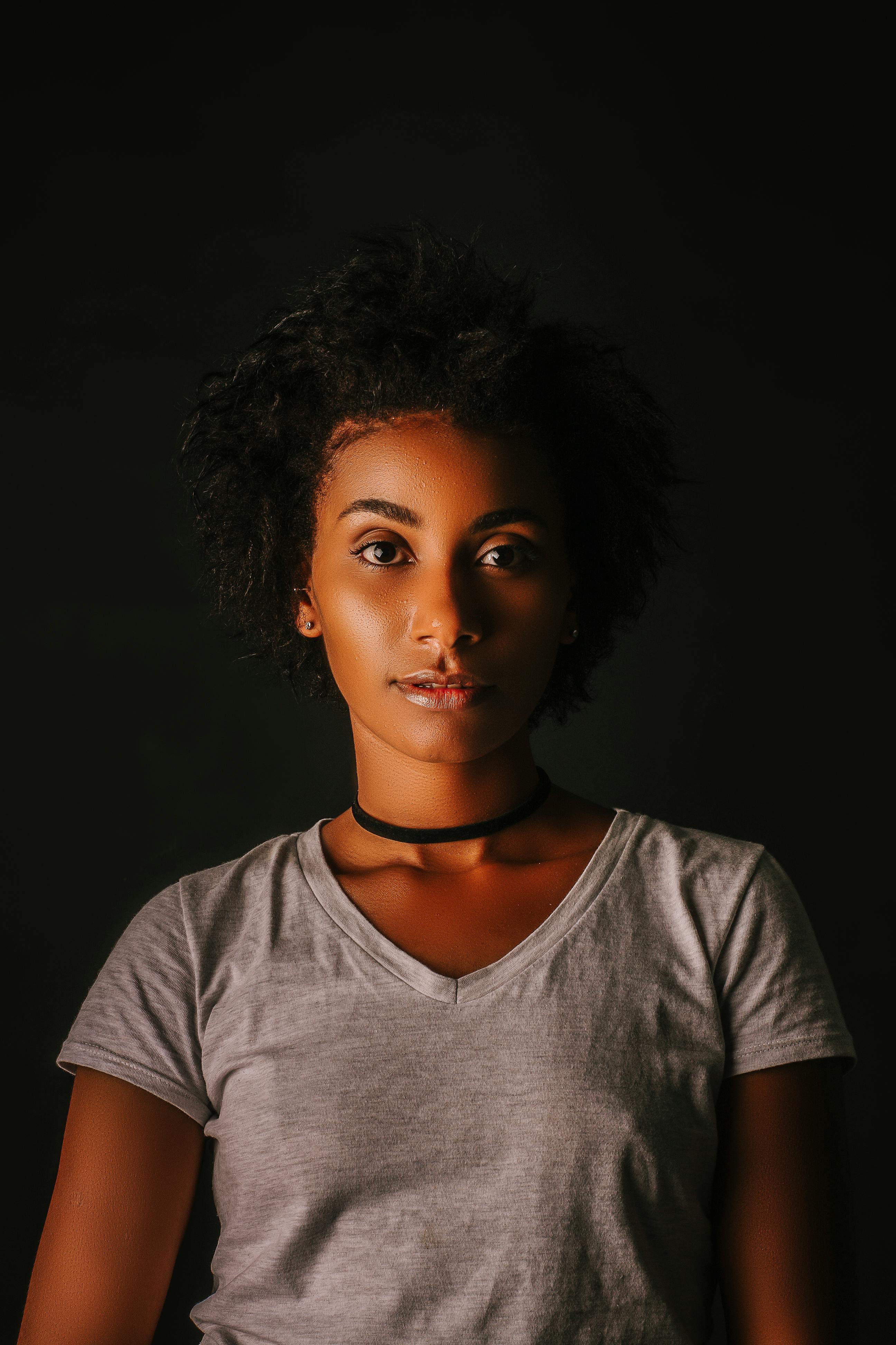 Woman Wearing Black Choker in Dark Room · Free Stock Photo