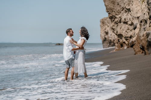 Couple Hugging on Sea Shore