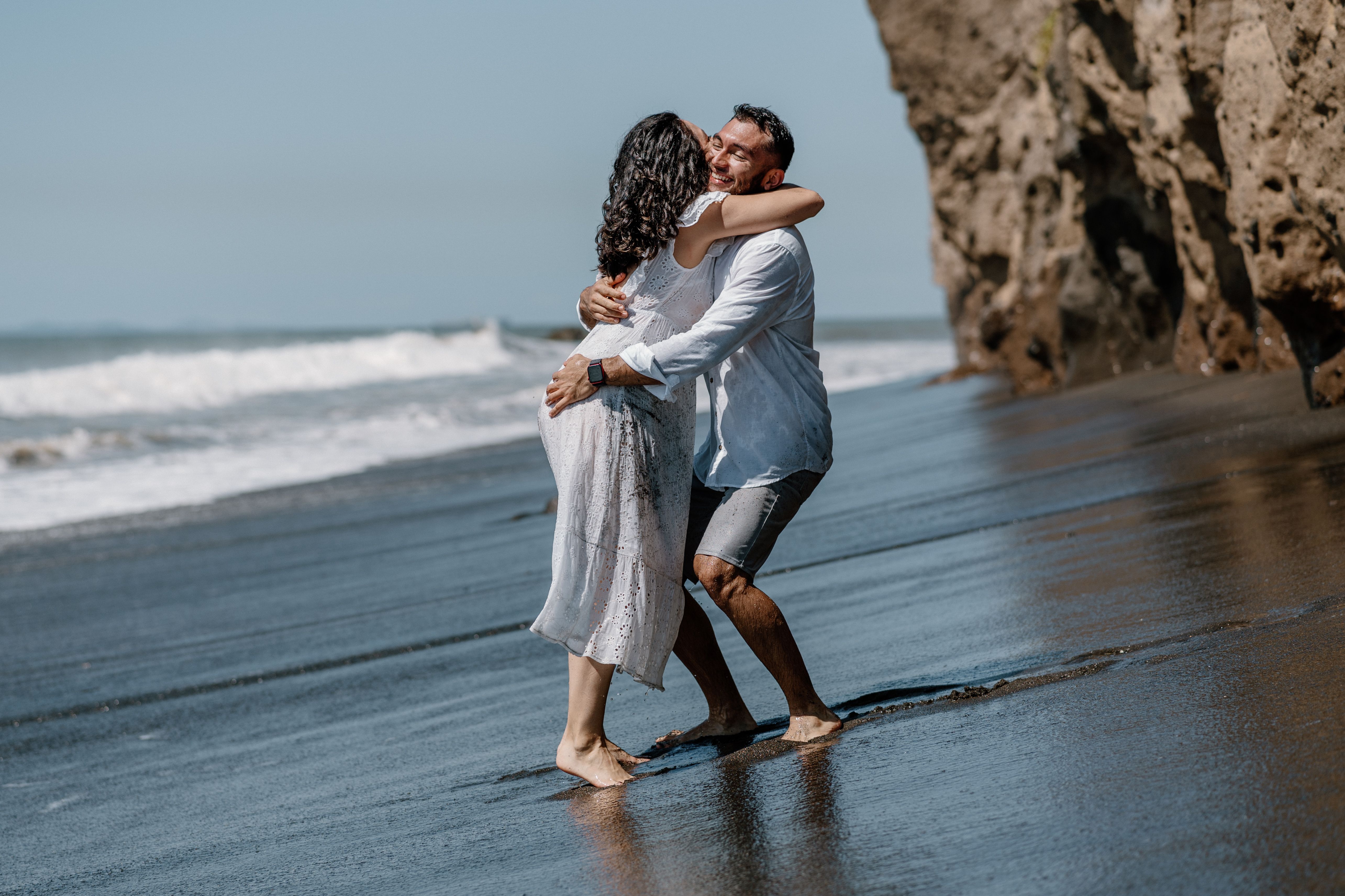 Man Hugging Woman on Sea Shore · Free Stock Photo