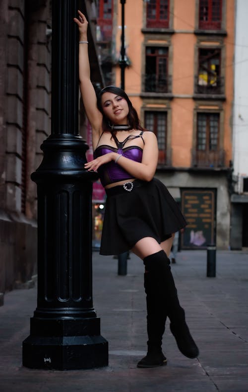 Smiling Woman in Purple Top and Black Skirt