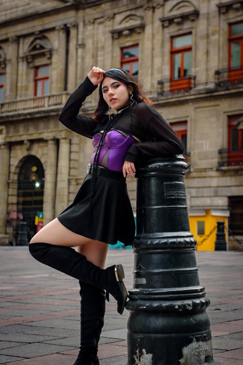 Female Model Posing on the Street by a Bollard