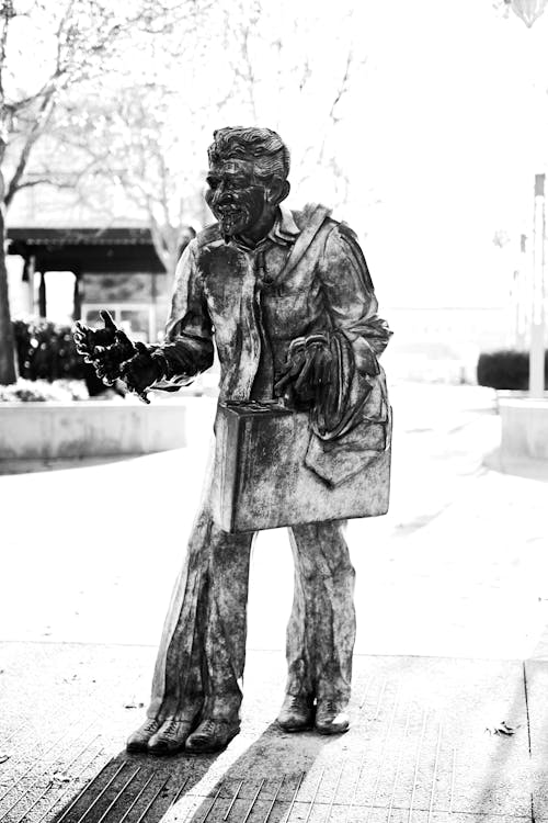 Elderly Man Statue in Park