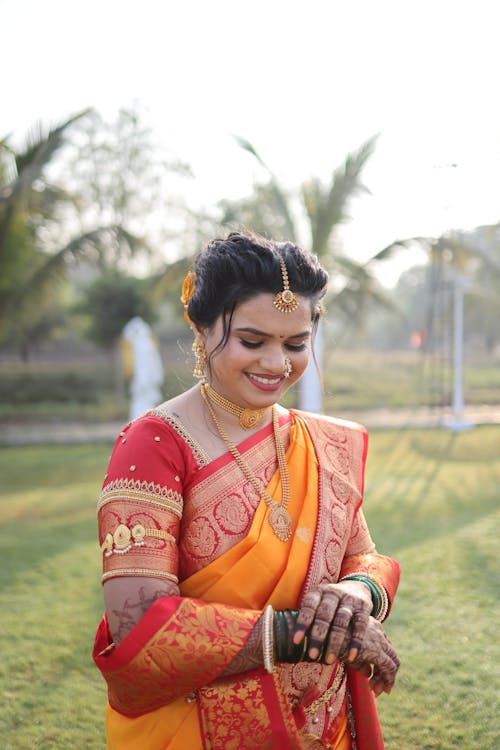 Smiling Woman Standing in Traditional Clothing