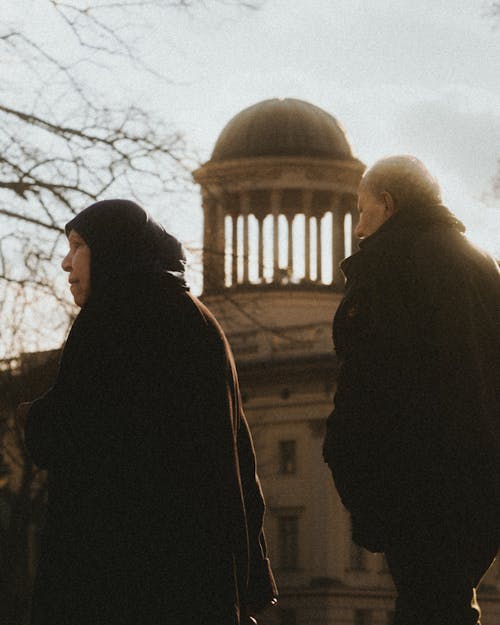 Elderly Man and Woman and Building Dome behind